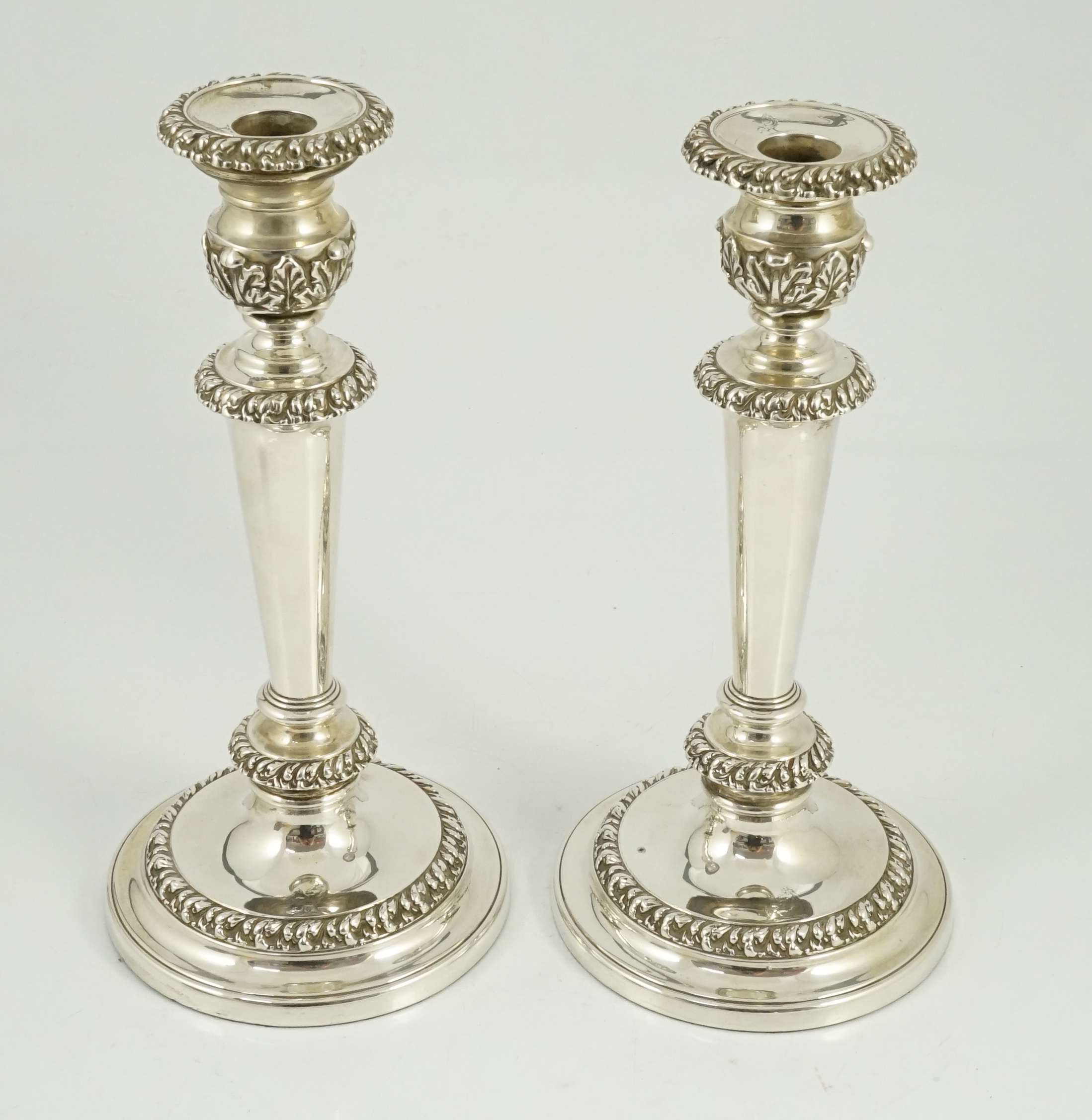 A pair of George III silver candlesticks by John & Thomas Settle